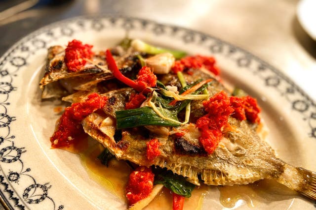 <p>Whole grilled John Dory served Thai-style, in as un-Thai a setting as you can imagine</p>