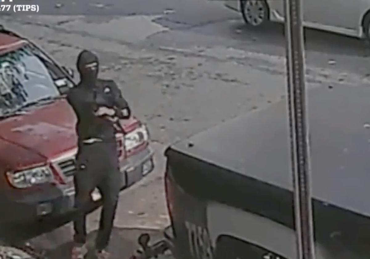 Masked gunman caught on camera opening fire on busy New York City street