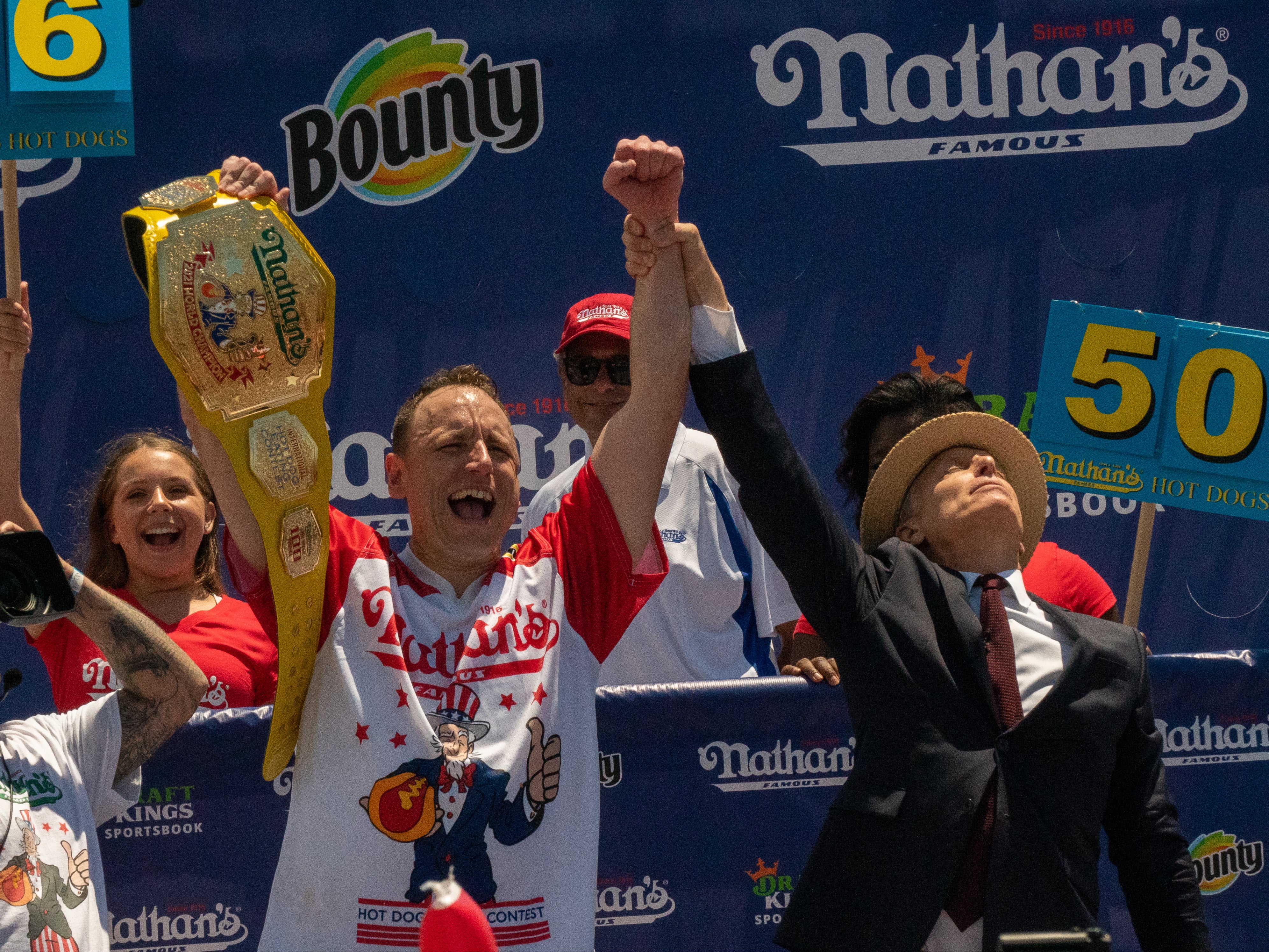 <p>Chestnut triumphed after devouring 76 hot dogs and buns in 10 minutes </p>