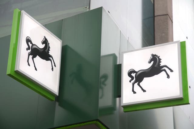 Lloyds Banking Group has revealed it swung to a £3.9bn half-year profit from a £602m loss a year ago as it cut bad debt provisions thanks to the UK’s economic recovery (Yui Mok/PA)