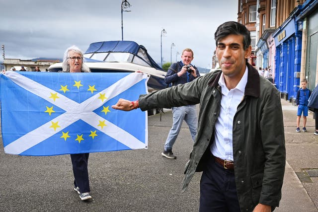 In this file photo from 2020, Sunak is greeted by nationalist demonstrators during a visit to the Isle of Bute