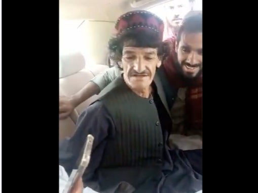 A screengrab from the video that shows comic Nazar Mohammad, better known as Khasha Zwan getting thrashed by Taliban men