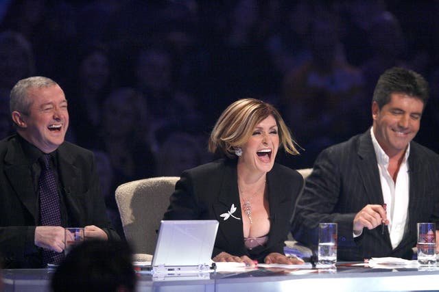 <p>Louis Walsh, Sharon Osbourne and Simon Cowell at the judges’ table on ‘The X Factor’ in 2005</p>