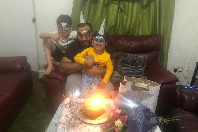 <p>Asim Riaz and his two sons celebrate a birthday just weeks before their tragic trip to Loch Lomond</p>