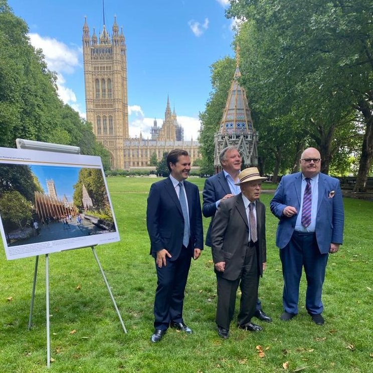 MP Robert Jenrick with holocaust survivors outside Houses of Parliament in Westminster on July 29.