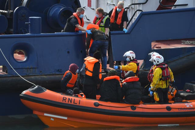<p>Migrants picked up at sea whilst crossing the English Channel are brought into the Marina in Dover, southeast England on September 11, 2020 on an RNLI lifeboat. </p>