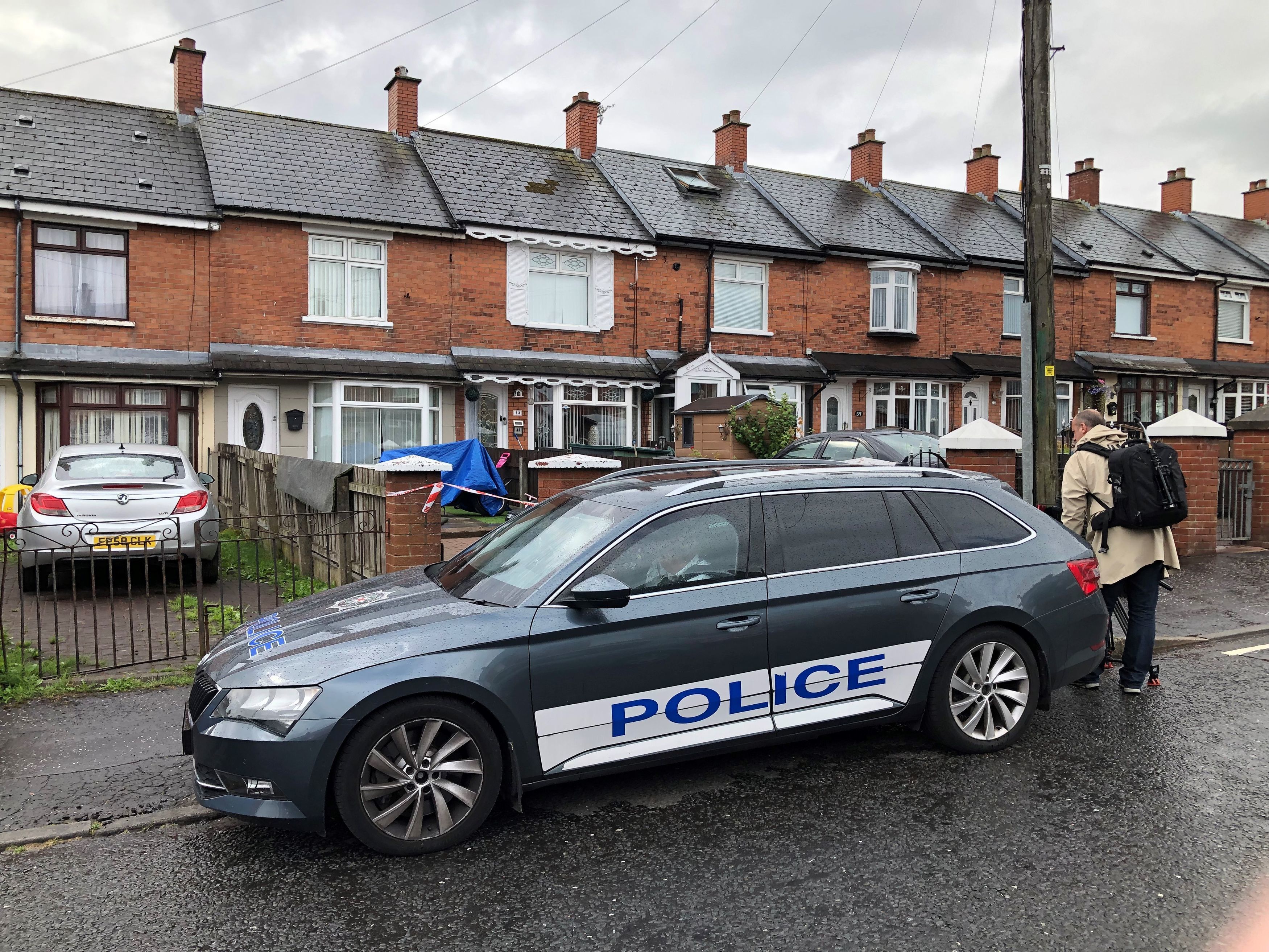 Police at the scene in Brompton Park, Belfast, where a baby died and another young child was critically injured