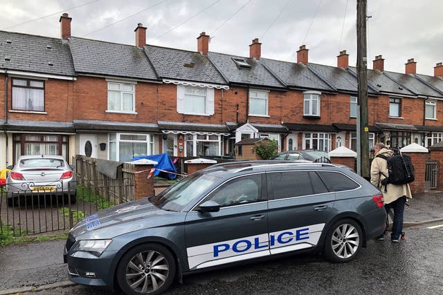 <p>Police at the scene in Brompton Park, Belfast, where a baby died and another young child was critically injured</p>