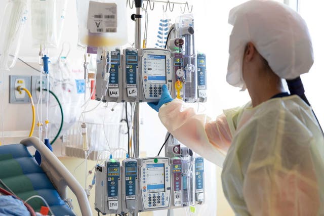 <p>Healthcare personnel work in a coronavirus disease (COVID-19) intensive care unit where they are dealing with a surge in cases of the Delta variant at Intermountain Medical Center in Murray, Utah, US</p>