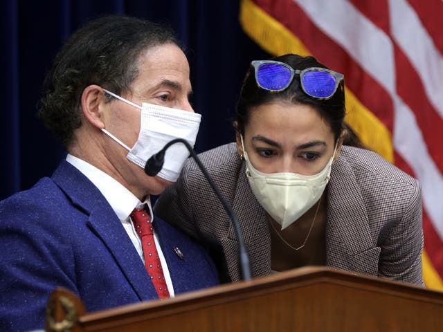 <p>Subcommittee Chairman Rep. Jamie Raskin (D-MD) (L) listens to Rep. Alexandria Ocasio-Cortez (D-NY) during a hearing. </p>