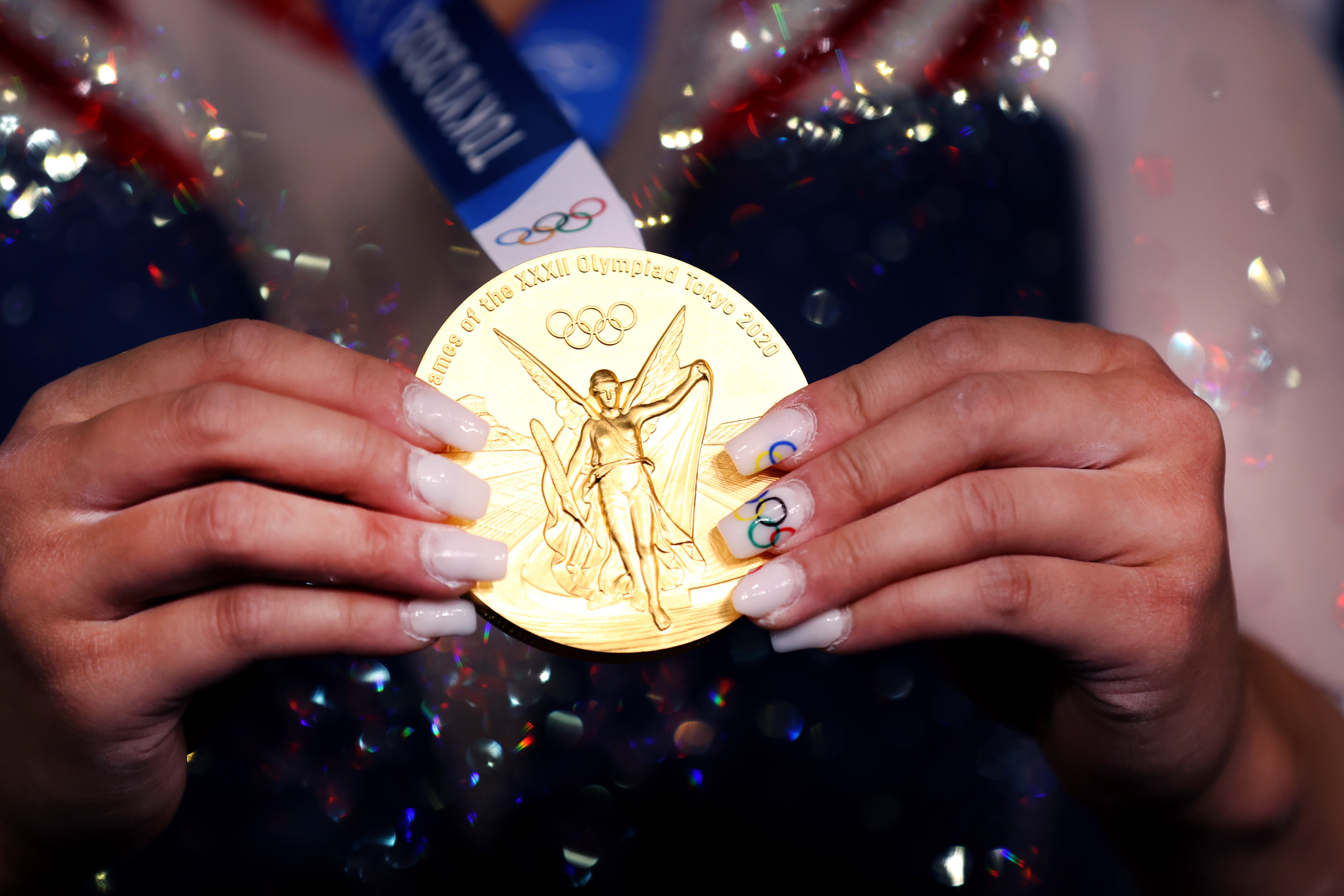 Sunisa Lee shows off gold medal and Olympic-inspired nails