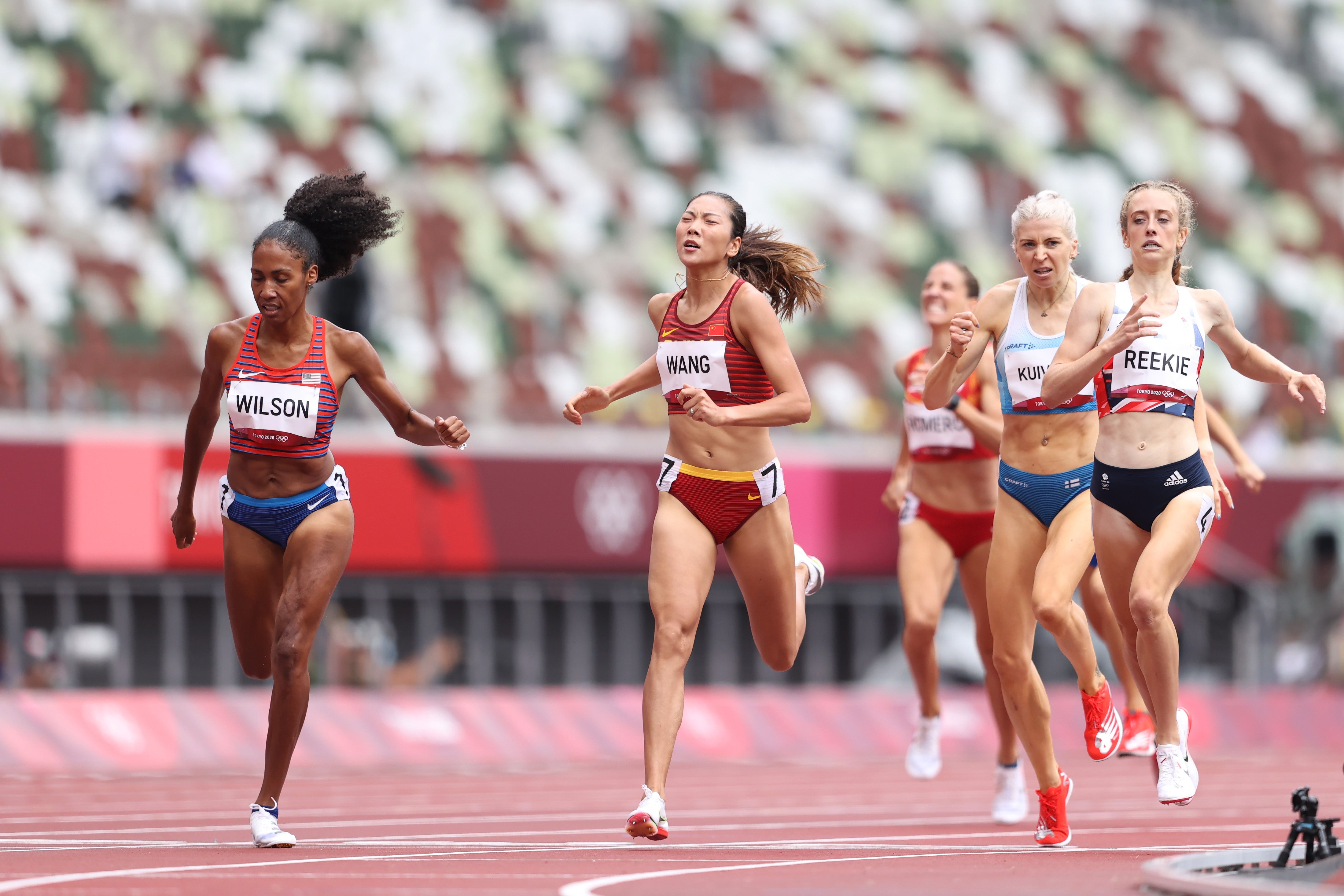 File: Ajee Wilson of Team United States and Chunyu Wang of Team China compete during the Women's 800m heats at the Tokyo 2020 Olympic Games