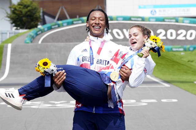<p>Team GB’s Bethany Shriever and Kye Whyte celebrate their gold and silver medals in the BMX Cycling at the Ariake Urban Sports Park</p>