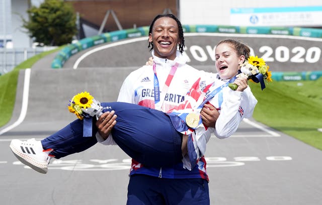 <p>Team GB’s Bethany Shriever and Kye Whyte celebrate their gold and silver medals in the BMX Cycling at the Ariake Urban Sports Park</p>