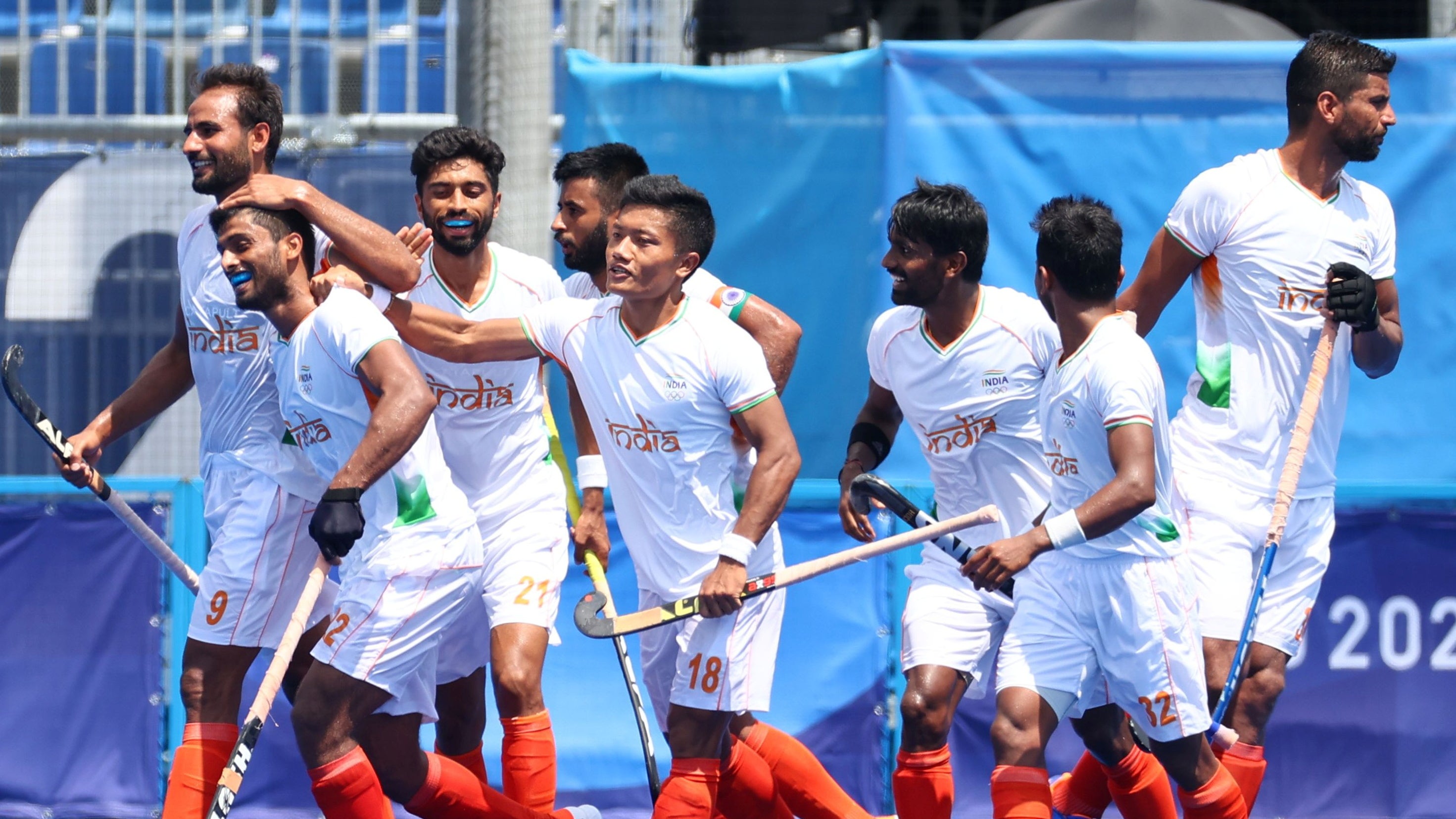 Varun Kumar of India celebrates with teammates after scoring against Argentina