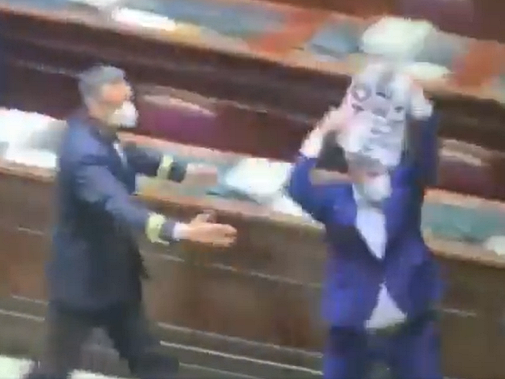 An Italian MP holding a “no green pass” sign was chased out of parliament by security during a protest against Italy’s vaccine passport scheme