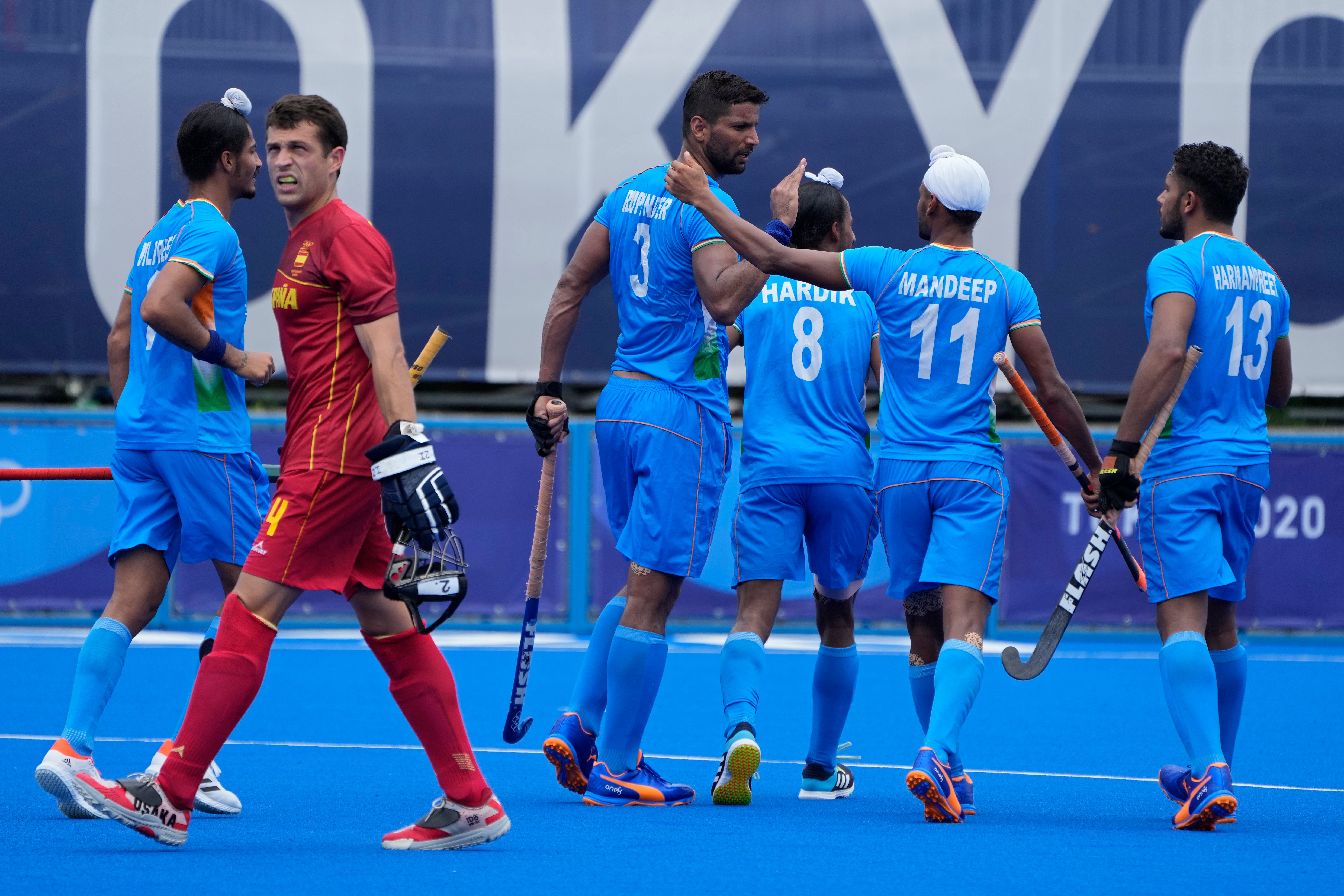 India's Rupinder Pal Singh (3) celebrates after scoring against Spain during a Men's hockey group stage match in Tokyo on Tuesday, 27 July