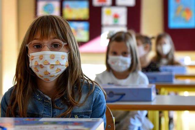 <p>The Centres for Disease Control and Prevention issued guidance on Tuesday urging everyone in school buildings to wear masks</p>
