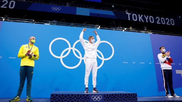 <p>Silver medallist Australia's Kyle Chalmers (L) Gold medallist USA's Caeleb Dressel (C) and Russia's Kliment Kolesnikov react during the medal presentation after the final of the men's 100m freestyle swimming event during the Tokyo 2020 Olympic Games at the Tokyo Aquatics Centre in Tokyo on July 29, 2021.</p>