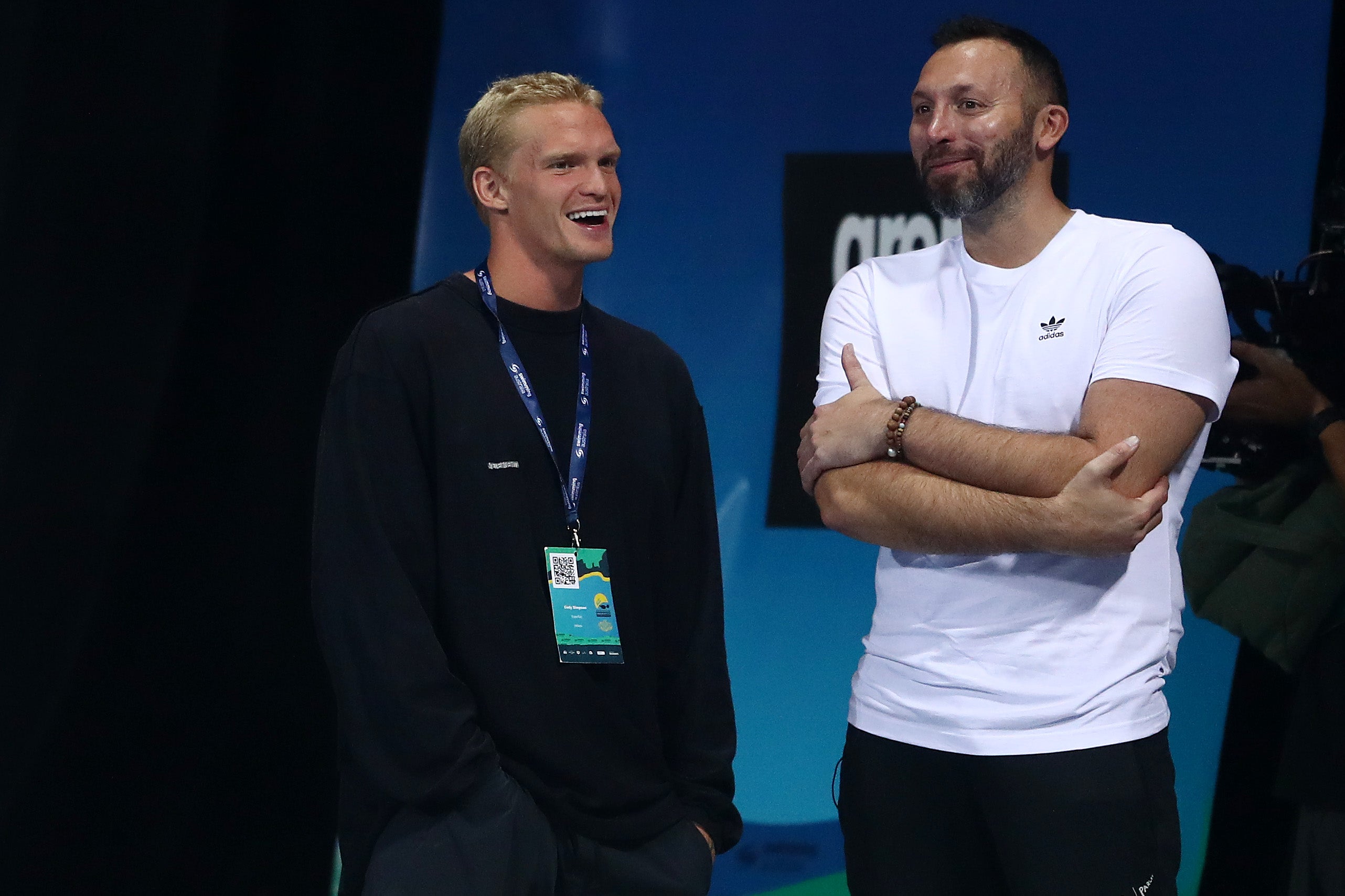 Cody Simpson and Ian Thorpe talk during the 2021 Australian Swimming Championships at the Gold Coast Aquatic Centre on April 15, 2021 in Gold Coast, Australia.