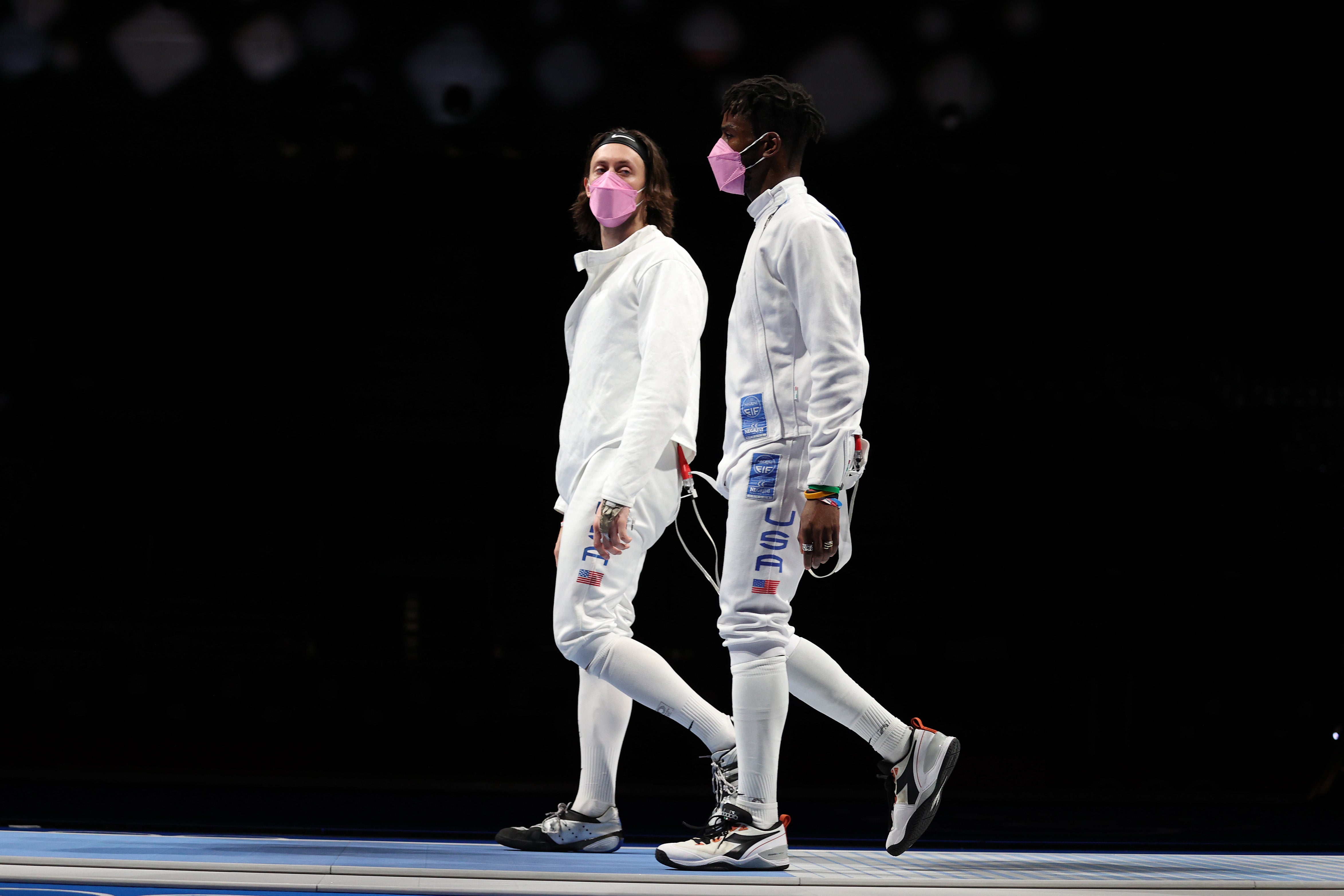 Jacob Hoyle of Team United States, left, and Curtis McDowald of Team United States react to their loss to Team Japan in Men's Épée Team Table of 16 on day seven of the Tokyo 2020 Olympic Games at Makuhari Messe Hall on July 30, 2021 in Chiba, Japan.