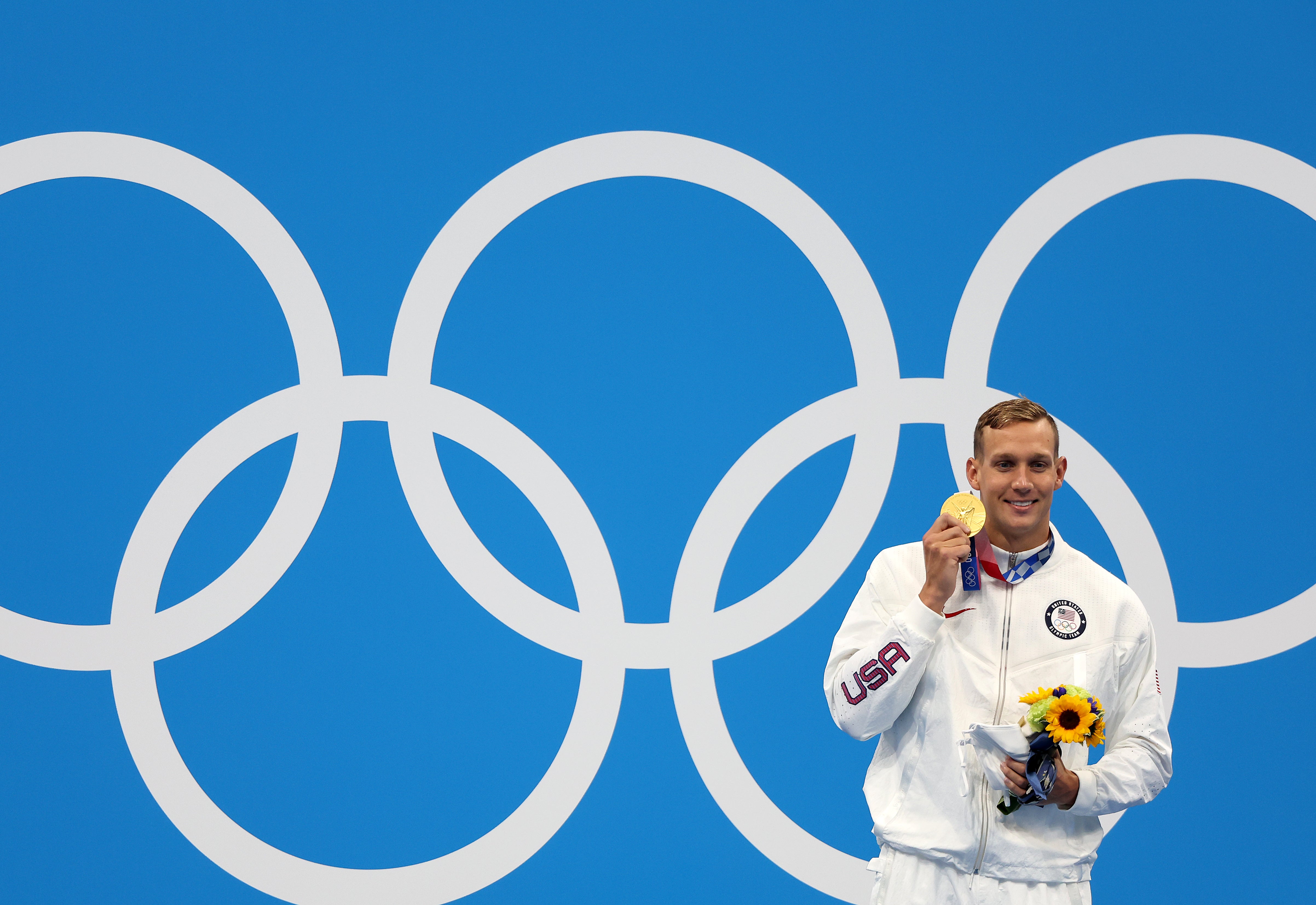 Caeleb Dressel celebrates with Olympic gold