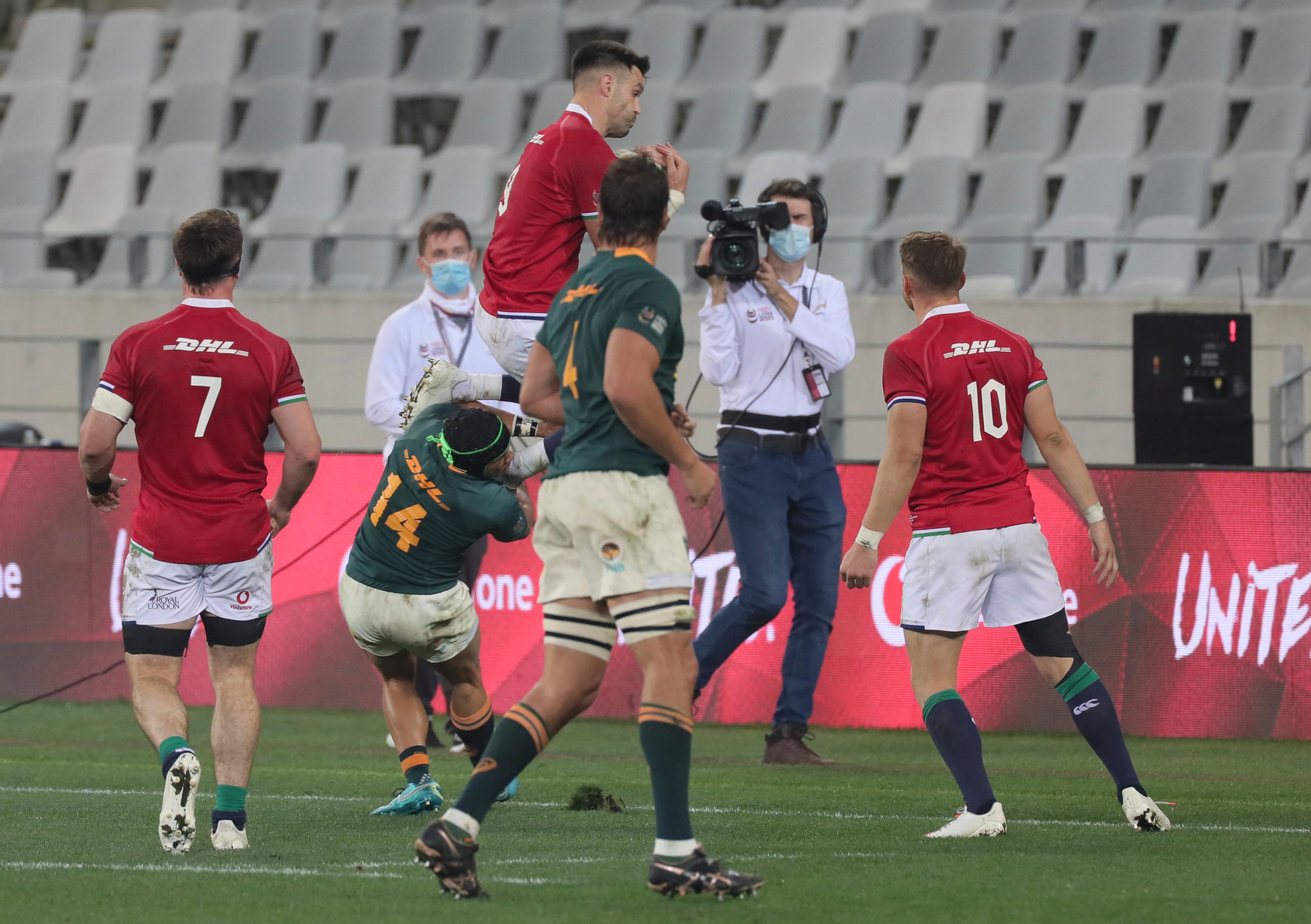 British and Irish Lions' Conor Murray, top, is late tackled by South Africa's Cheslin Kolbe