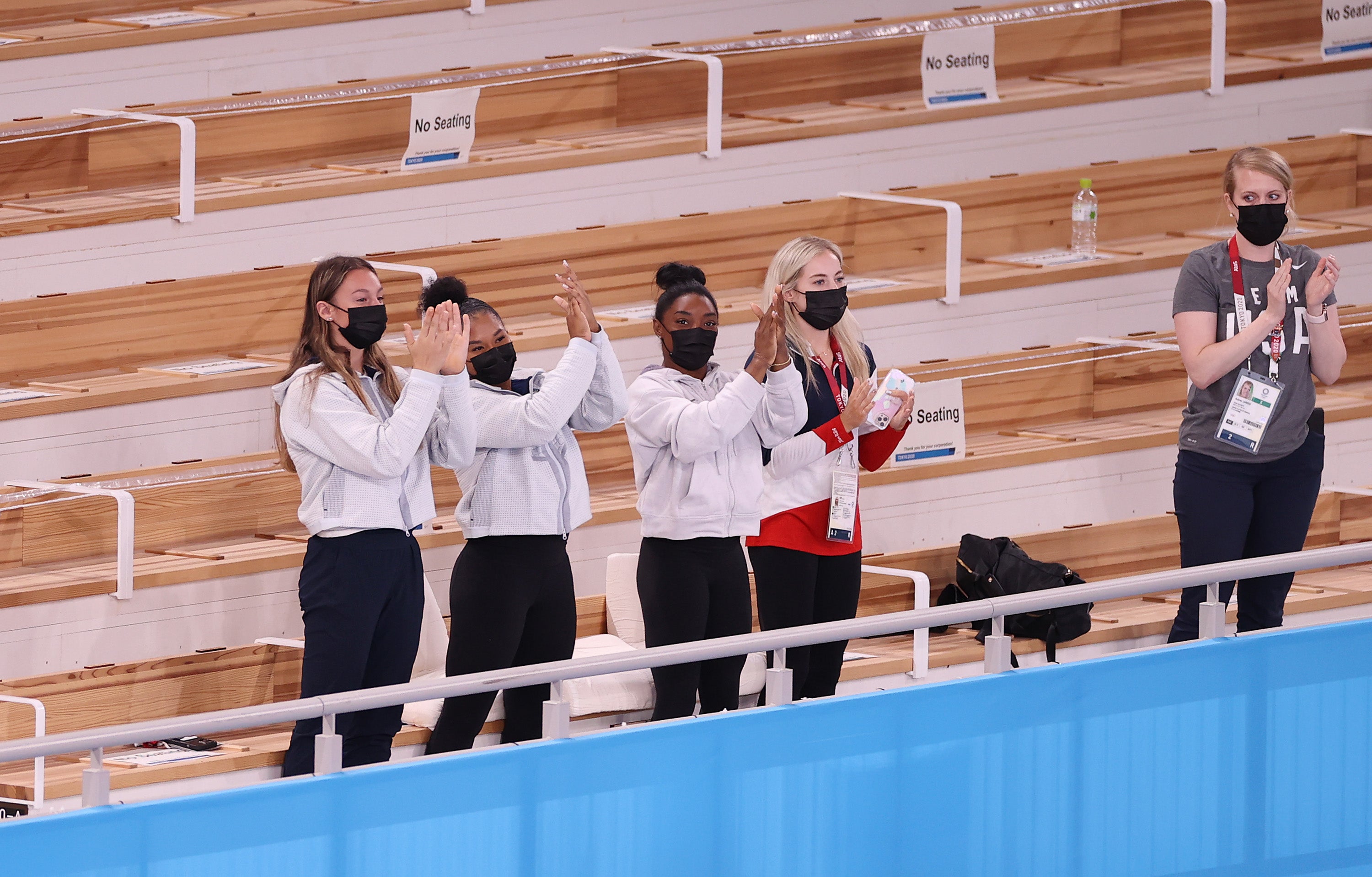 Grace McCallum, Jordan Chiles, Simone Biles and Mykayla Skinner, of Team United States, cheer after Sunisa Lee wins the gold medal in the Women’s all-around final