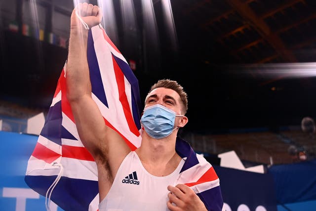 <p>Max Whitlock celebrates his second consecutive Olympic gold medal</p>