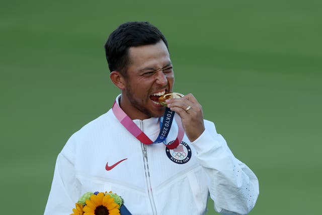 <p>USA’s Xander Schauffele celebrates with his gold medal</p>