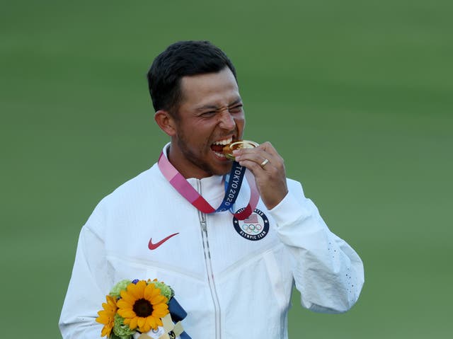 <p>USA’s Xander Schauffele celebrates with his gold medal</p>