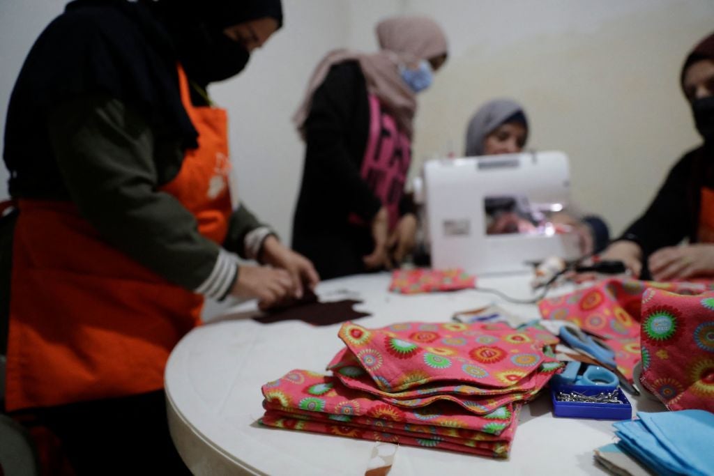 Members of international NGO Days For Girls and local partner WingWoman Lebanon assemble reusable sanitary kits in the Palestinian refugee camp of Shatila