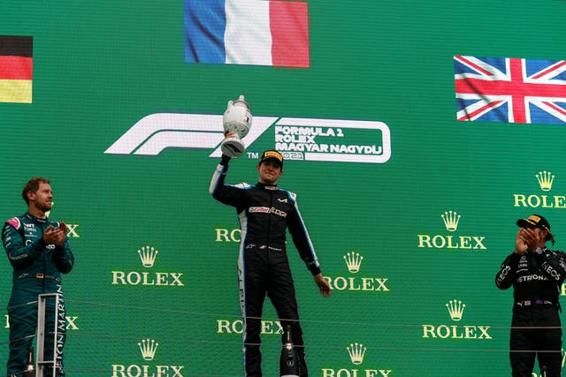 <p>Esteban Ocon celebrates after beating Sebastian Vettel and Lewis Hamilton to victory</p>
