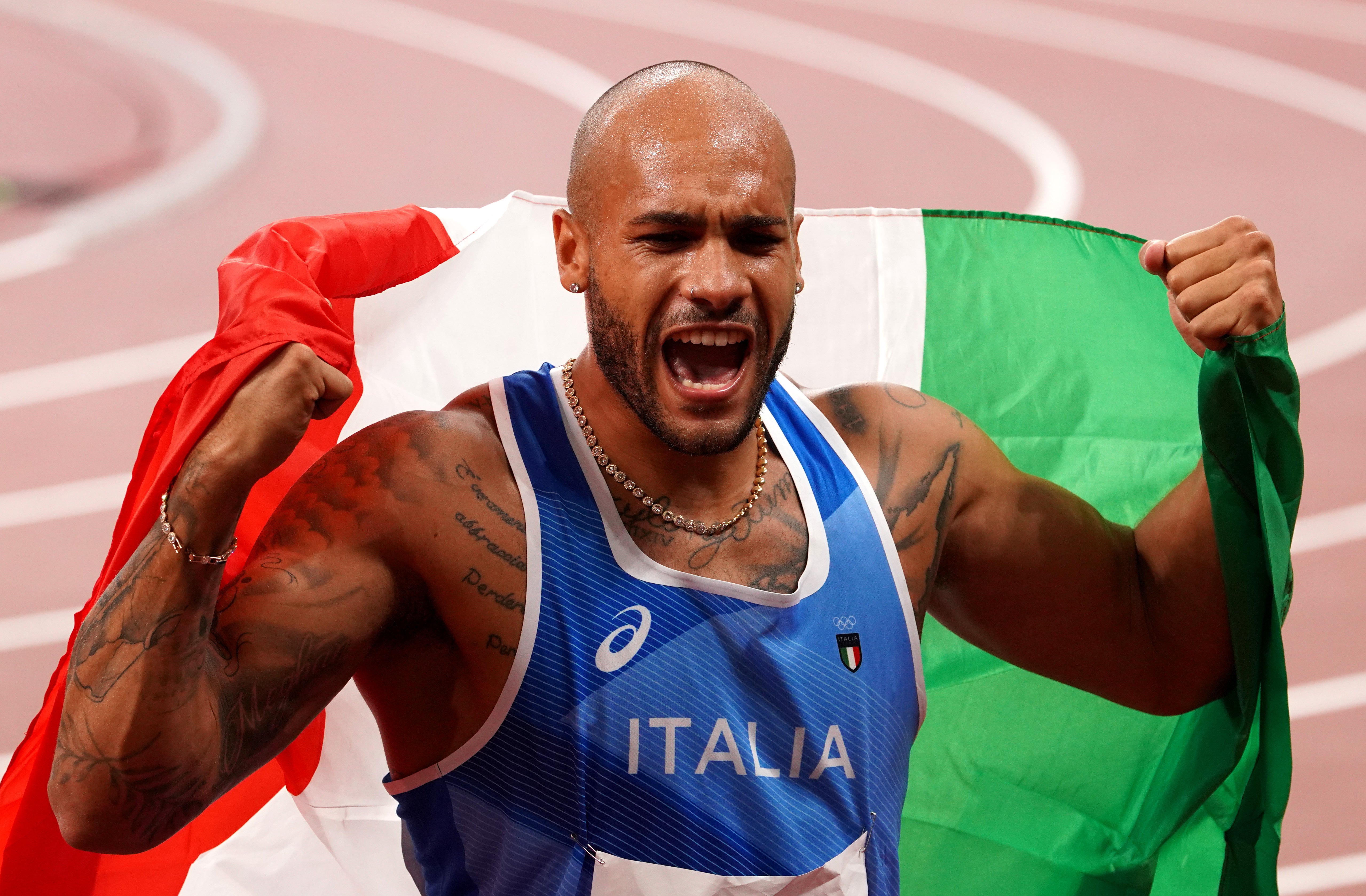 Italy’s Marcell Jacobs celebrates winning the 100m in Tokyo. (Martin Rickett/PA)