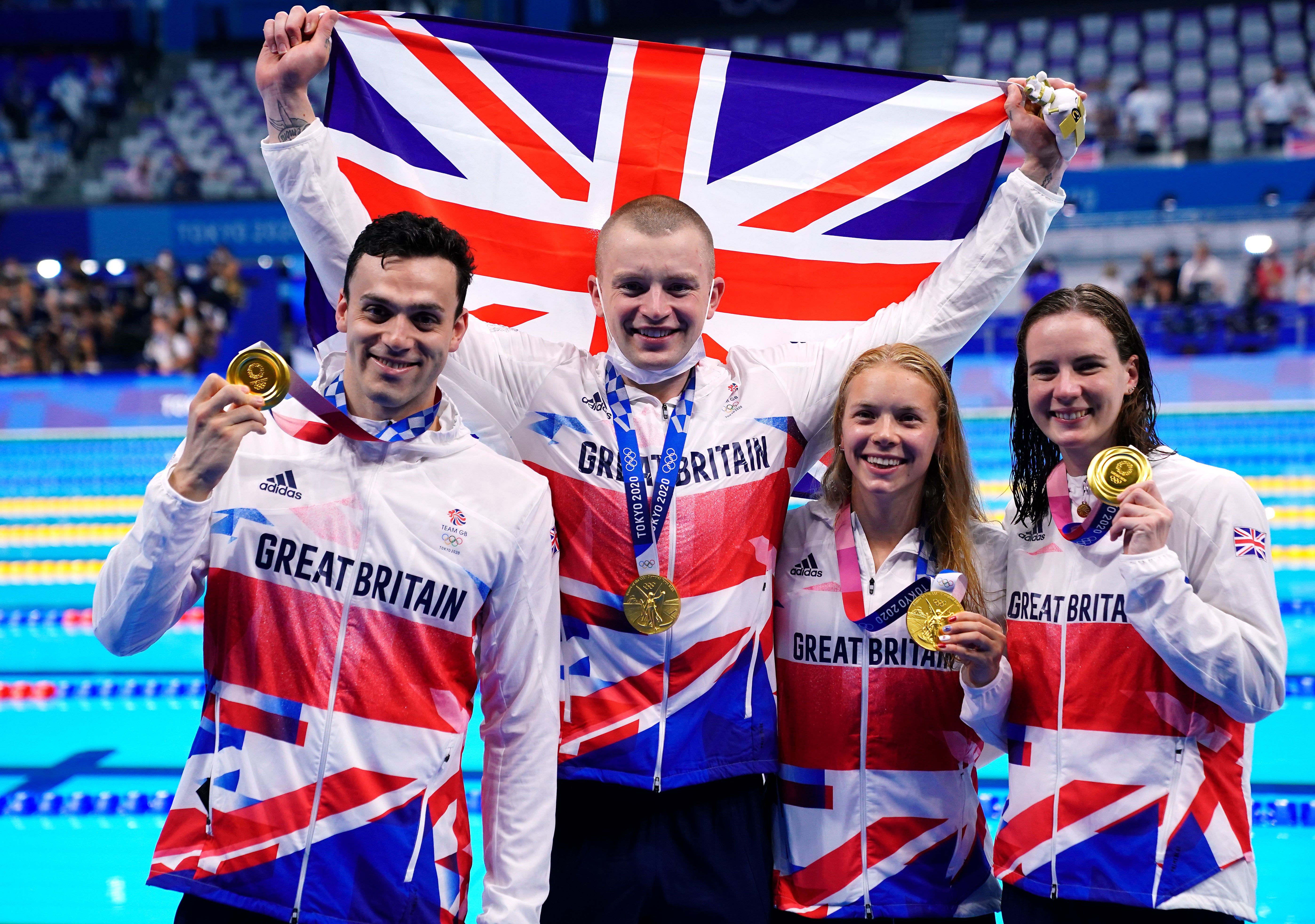 Adam Peaty, James Guy, Anna Hopkin and Kathleen Dawson receive their gold medals for the mixed 4 x 100m medley relay (Adam Davy/PA)