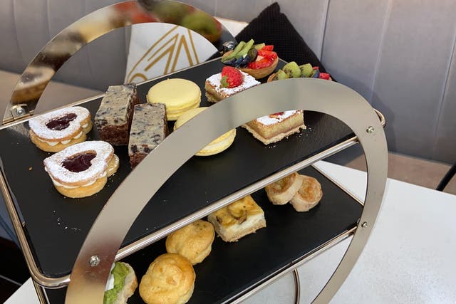 <p>The afternoon tea tray features far more than cucumber and watercress sandwiches</p>