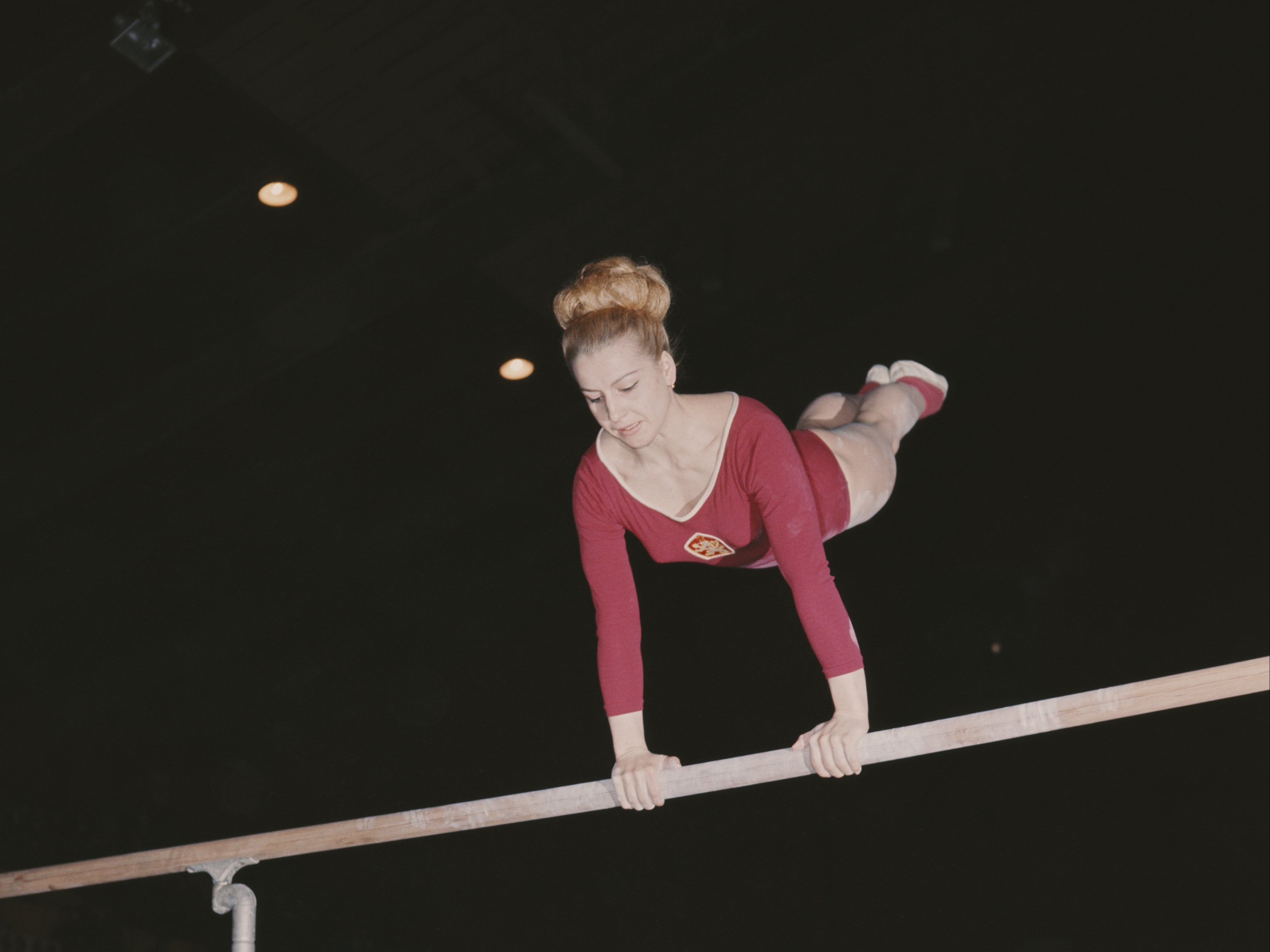 Czech gymnast and seven time Olympic Gold medallist Vera Caslavska competes on the uneven bars 1st June 1968 in London