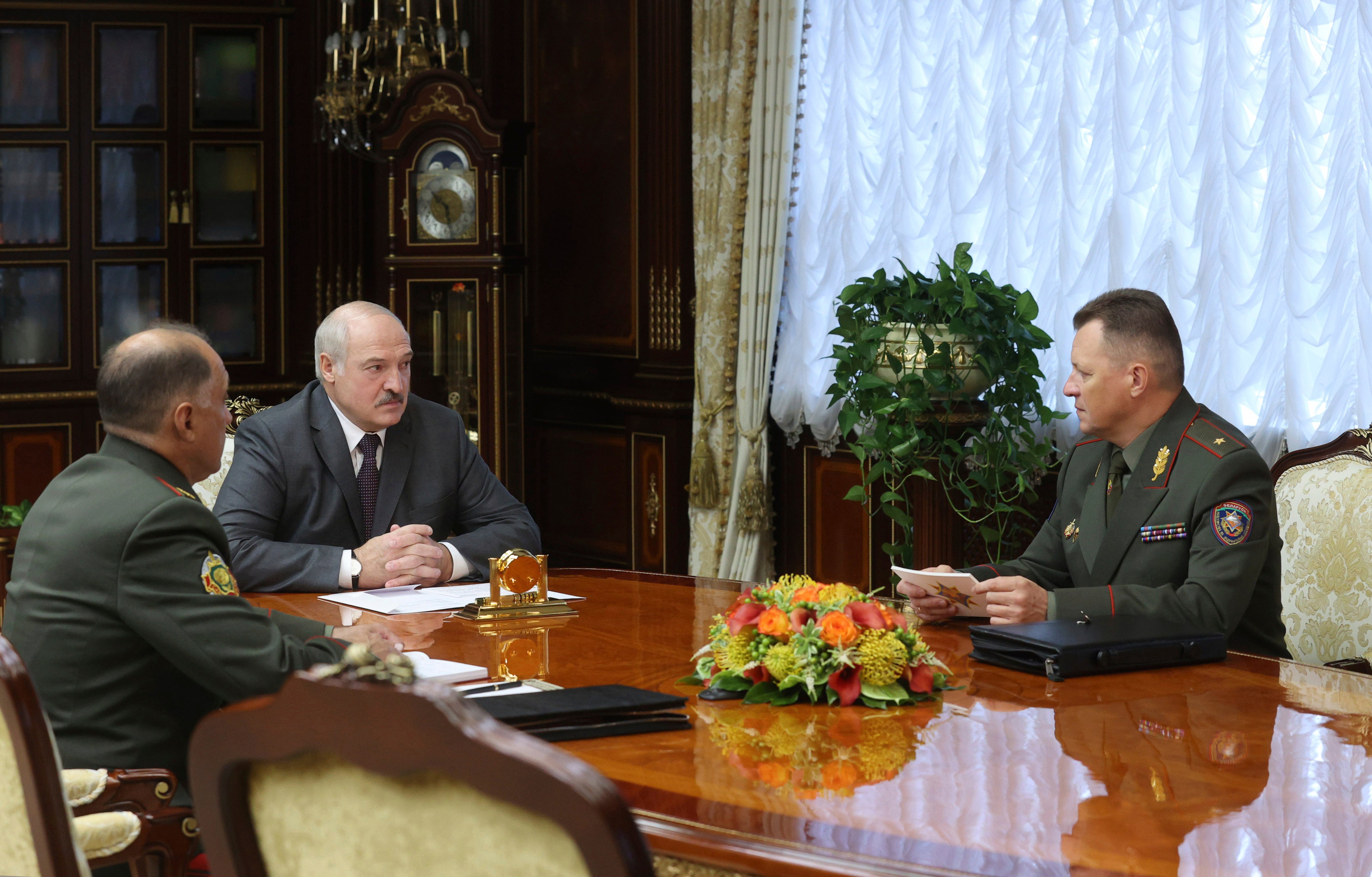 Belarusian president Alexander Lukashenko, centre, held a meeting in Minsk with security officials on Monday