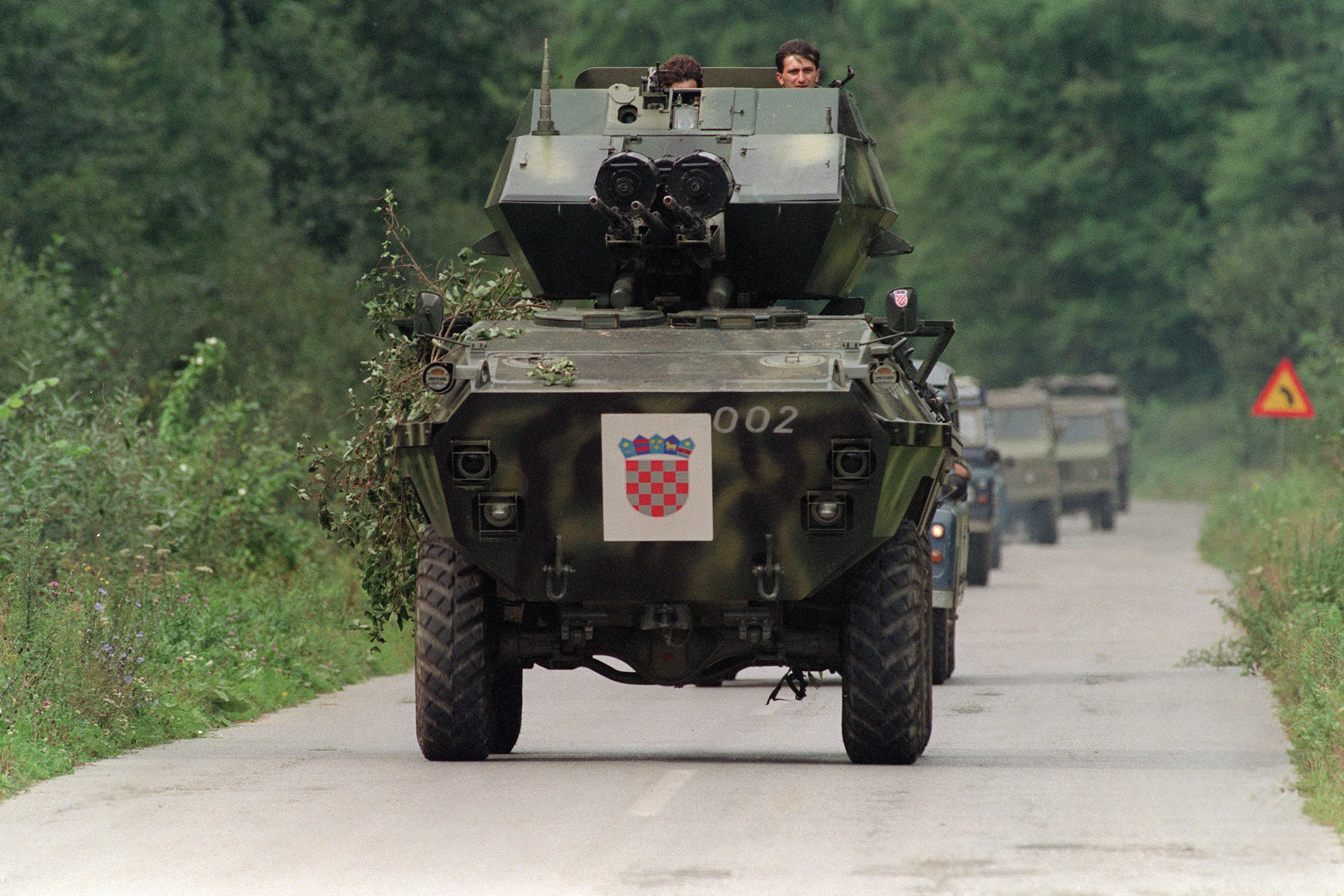 Croatian soldiers operate an armoured personnel carrier equipped with three heavy machine guns, 26 September 1991