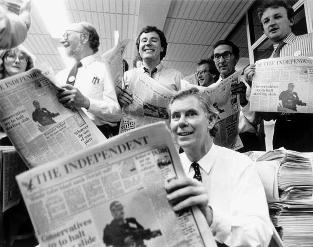 <p>Andreas Whittam Smith, editor and founder, with the first copy of the paper</p>