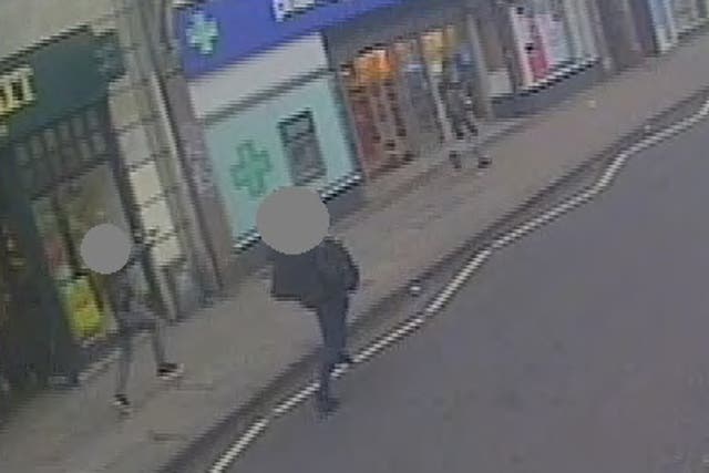 <p>A CCTV still showing undercover armed police officers chasing Amman, right, with their guns drawn after he stabbed two people in the Streatham attack</p>