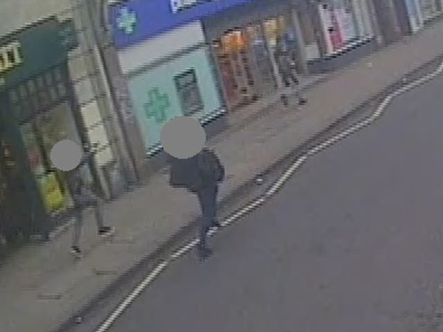 <p>A CCTV still showing undercover armed police officers chasing Sudesh Amman, right, with their guns drawn after he stabbed two people in the Streatham attack</p>