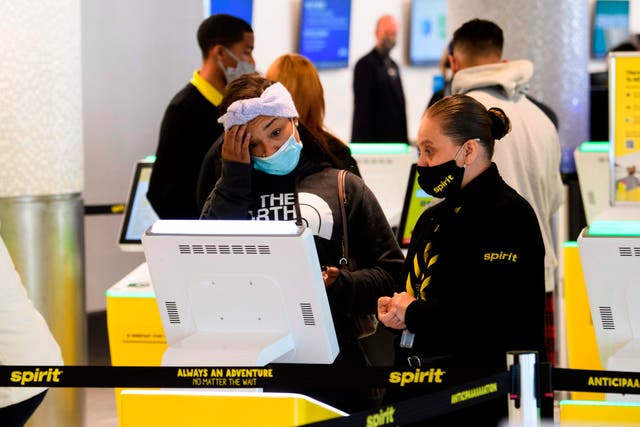 <p>File photo of a passenger checking into Spirit Airlines flight </p>