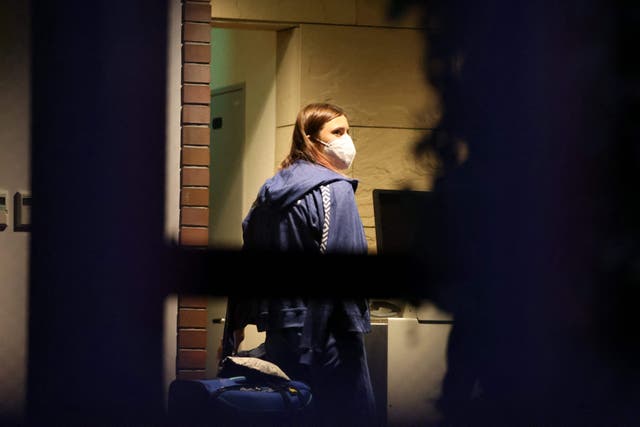 <p> Belarus athlete Krystsina Tsimanouskaya, who claimed her team tried to force her to leave Japan following a row during the Tokyo 2020 Olympic Games, walks with her luggage inside the Polish embassy in Tokyo on August 2, 2021. </p>