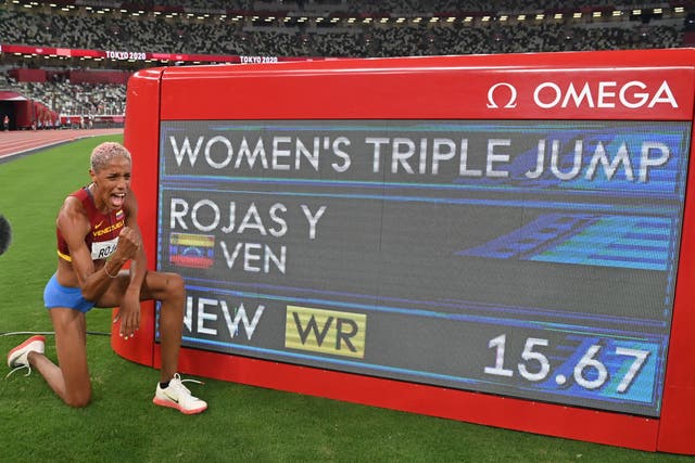 <p>First-placed Venezuela's Yulimar Rojas celebrates the new world record after competing in the women's triple jump final during the Tokyo 2020 Olympic Games at the Olympic Stadium in Tokyo on August 1, 2021.</p>