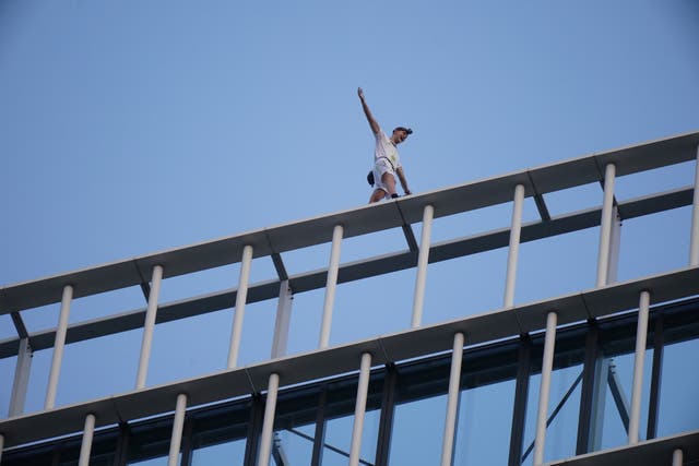 <p>File: Free-solo climber George King-Thompson walks along the top of the Stratosphere Tower building, a 36-storey residential tower block in Stratford, east London </p>