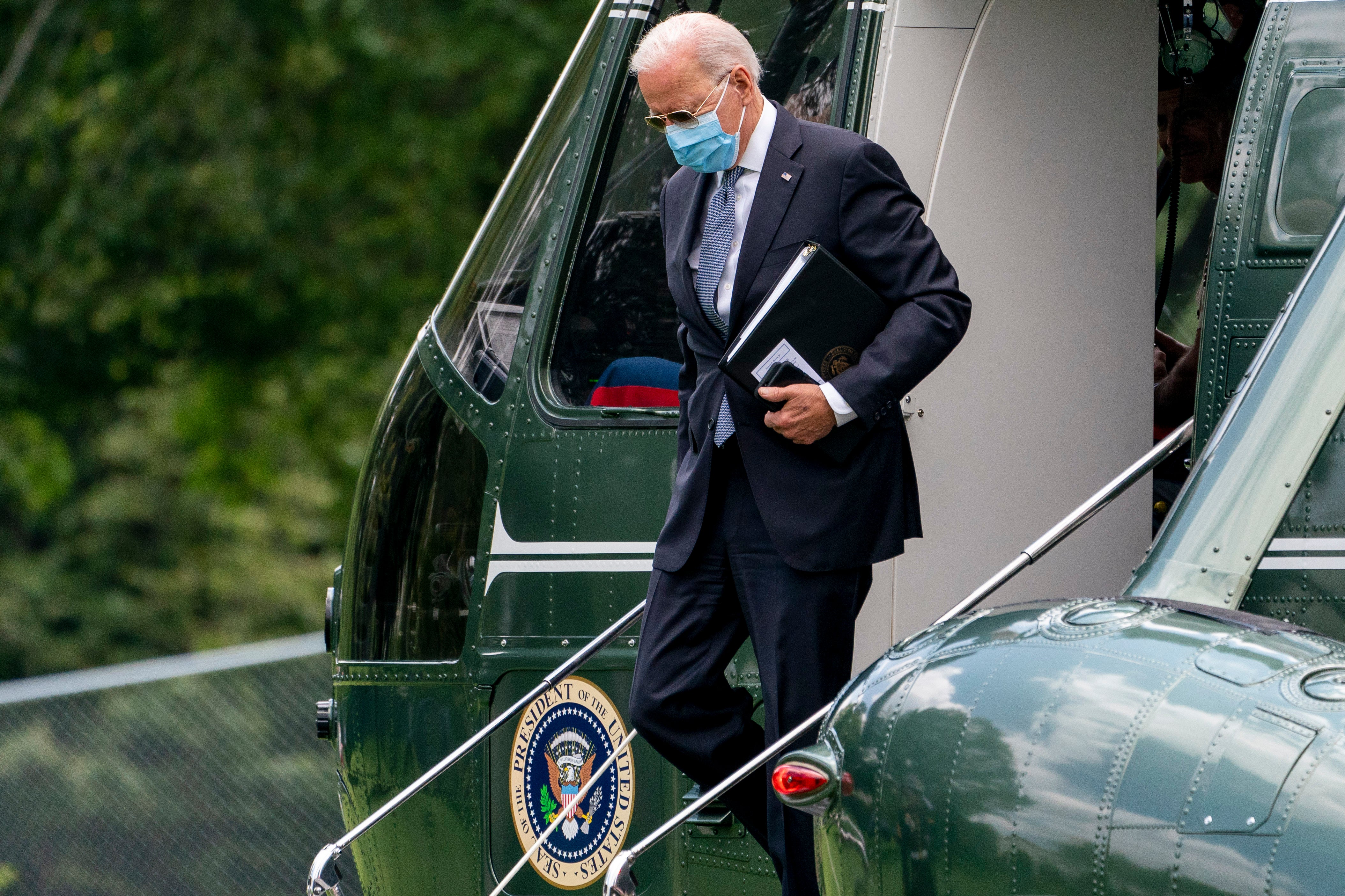 President Joe Biden exits Marine One earlier in August