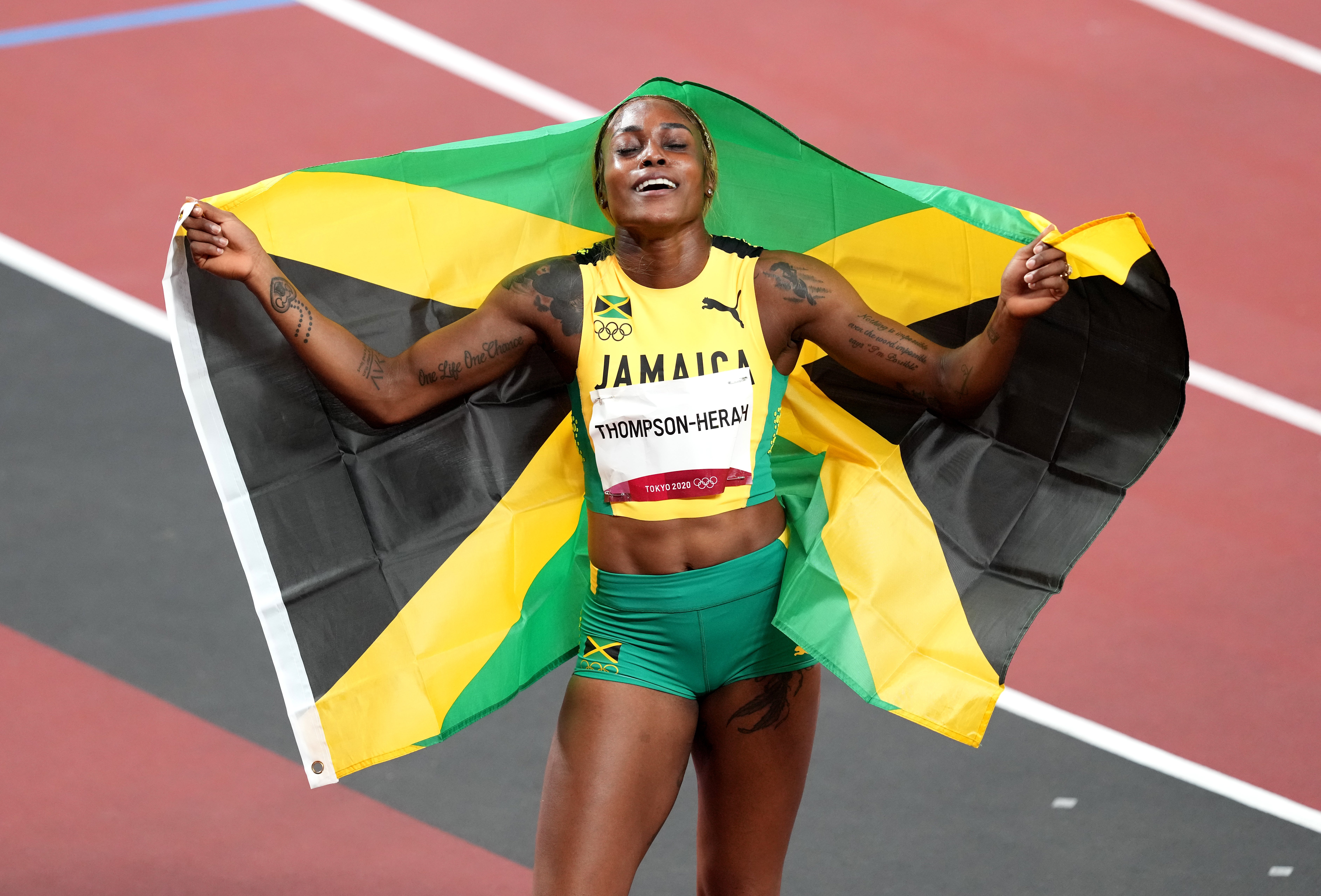 <p>Jamaica’s Elaine Thompson-Herah, who has won the 100m and 200m double, celebrates in the Olympic Stadium</p>