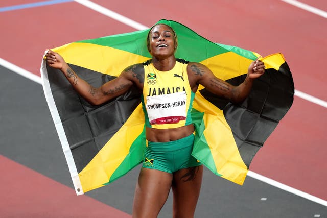 <p>Jamaica’s Elaine Thompson-Herah, who has won the 100m and 200m double, celebrates in the Olympic Stadium</p>