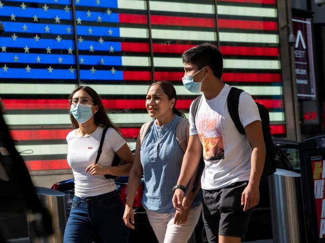 <p>People wear masks around Times Square, as cases of the infectious coronavirus Delta variant continue to rise in New York City, New York</p>
